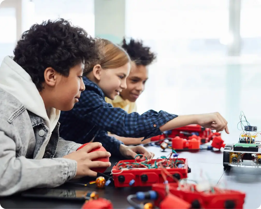 Children collaborating on robotics and creative building projects